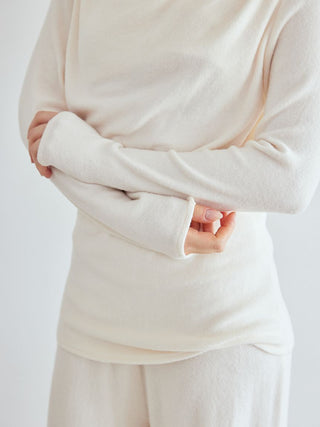 Woman wearing white Snow Long Sleeve Shirt Loungewear, showcasing soft fabric and elegant design for cozy, chic comfort.