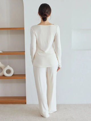 Back view of white snow long sleeve loungewear from Gelato Pique USA, featuring an elegant draped neckline and relaxed silhouette.