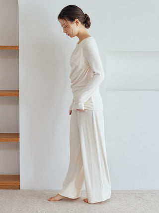 Woman wearing Snow Long Sleeve Shirt Loungewear in a light room, showcasing the relaxed, elegant design by Gelato Pique USA.