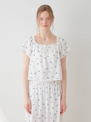 Floral Print Smocked Crop Top in blue daisy pattern on white, perfect for a fresh and feminine look, by Gelato Pique.