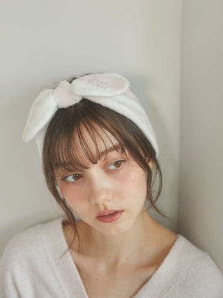 Woman wearing white Smoothie 2-Border Headband with bow detail from Gelato Pique USA, perfect for premium loungewear and sleepwear.