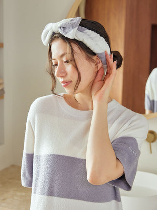 Woman wearing Gelato Pique USA Durable Smoothie Border Headband, premium loungewear for skincare and relaxation.