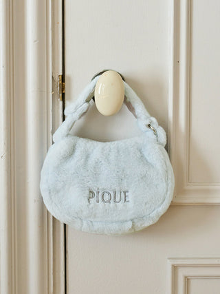 Gelato Pique faux fur mini handbag in soft blue, eco-friendly and ideal for a winter wardrobe accessory.