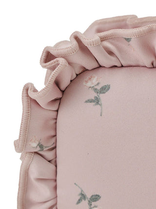 Close-up of a pink pouch with floral pattern and ruffled edges, showcasing elegant design and Gelato Pique’s signature touch.