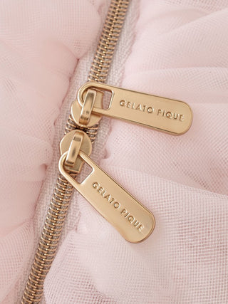 Close-up of a pink tulle pouch with gold Gelato Pique zipper pulls