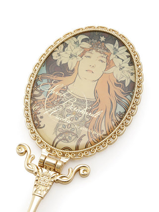 A beautiful hand mirror printed with Alphonse Mucha's iconic art nouveau poster of Sarah Bernhardt. This piece is perfect for adding a touch of vintage charm. Half shot. 