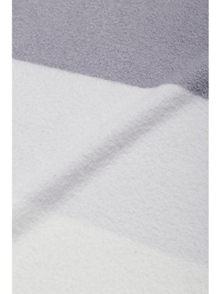 Close-up of Durable Smoothie Border Lap Blanket from Gelato Pique USA, showcasing its soft texture. Perfect for premium loungewear.