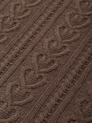 Close-up of Heart Aran Lap Blanket with intricate brown Aran cable-knit heart pattern, cozy home decor.