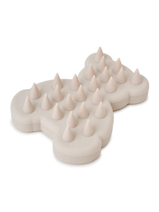 Bear shampoo brush in beige, featuring soft protrusions for scalp massage and dirt removal.