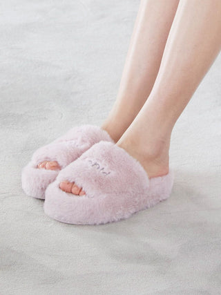 Person wearing pink open-toe Eco Fur Fuzzy Slippers by Gelato Pique on a soft surface, showcasing plush faux fur design.