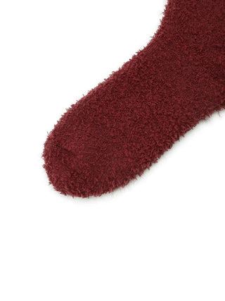 Close-up of maroon Feather Fuzzy Socks showcasing plush, feather-textured fabric, perfect for warmth and comfort.