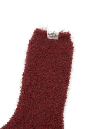 Maroon feather fuzzy socks with soft texture for ultimate comfort and warmth.