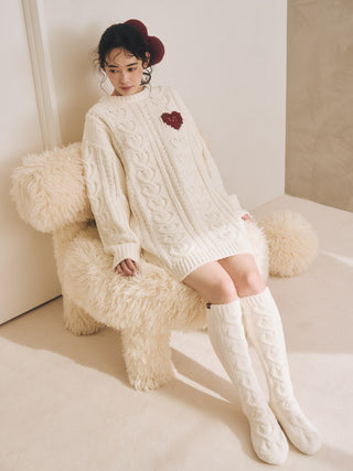 Model wearing Heart Aran Long Socks and sweater, showcasing cozy winter loungewear with classic cable-knit design.