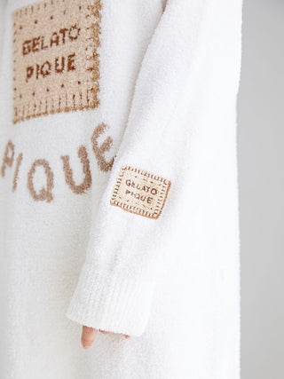 Close-up of Powder Biscuit Jacquard Lounge Dress sleeve from Gelato Pique showcasing soft, plush fabric with logo detail.