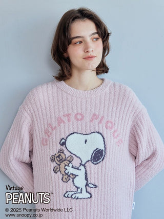 Woman wearing a pink Snoopy Bear Jacquard Lounge Dress by Gelato Pique with charming vintage Peanuts design.