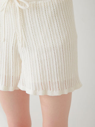 White crochet shorts with vertical ribbing by Gelato Pique, showcasing delicate knit design and elegant fit.