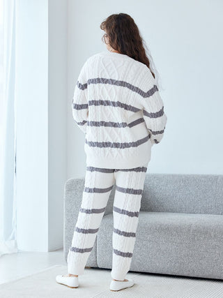 Woman wearing Baby Moco Aran Border Lounge Pants with striped knit pattern, designed for comfort and style by Gelato Pique.