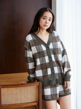 Woman wearing Air Moco Checkered Lounge Shorts and matching cardigan in cozy style.