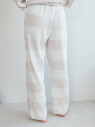 Back view of Smoothie 2-Border Pants in striped pastel colors, showcasing comfort and style.