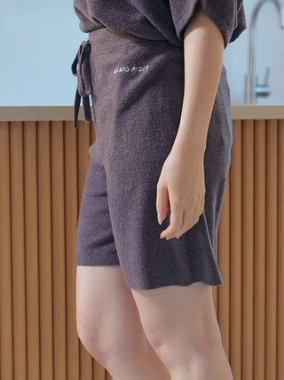 Woman wearing Smoothie Lite Lounge Shorts by Gelato Pique USA, premium loungewear and sleepwear, showing logo embroidery and pocket.
