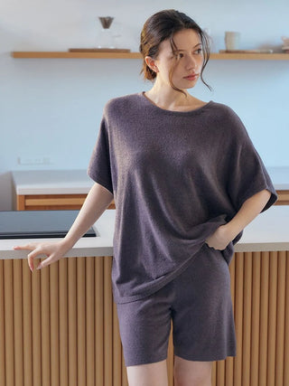 Woman wearing Gelato Pique USA's Smoothie Lite Lounge Shorts, premium loungewear perfect for spring, with simple design and pockets.