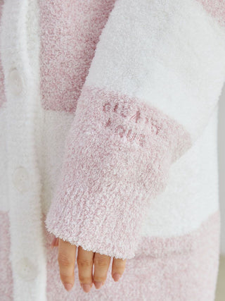 Close-up of Powder Melange Striped Long Cardigan sleeve with buttons, textured fuzzy fabric in pastel pink and white stripes.