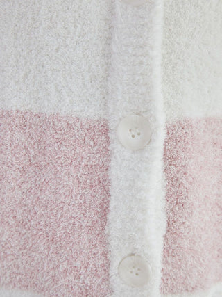 Close-up of a powder melange striped long cardigan fabric showing buttons and fuzzy texture in beige and pink.