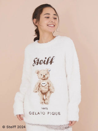 Woman wearing Steiff Gelato James Jacquard Pullover Sweater with teddy bear design, showcasing cozy and stylish winter fashion.