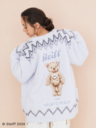 Woman wearing Steiff Fair Isle fuzzy cardigan with teddy bear design on back