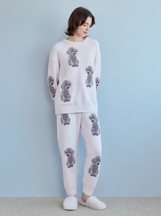 Person wearing a cozy Toy Poodle Pullover Sweater with jacquard poodle motifs, featuring soft plush fabric for lounging comfort.