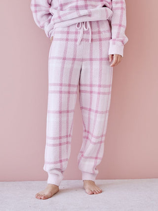 Woman wearing a pastel checkered pajama set from Gelato Pique, showcasing soft and cozy fabric with a relaxed fit.