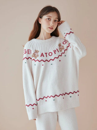 Girl wearing white Nordic-patterned pullover and shorts, crafted from soft 'Baby Moco' material, perfect for holiday comfort.