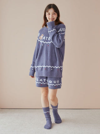 Woman wearing Nordic pullover and shorts set with festive patterns, made of soft Baby Moco material, perfect for holiday comfort.