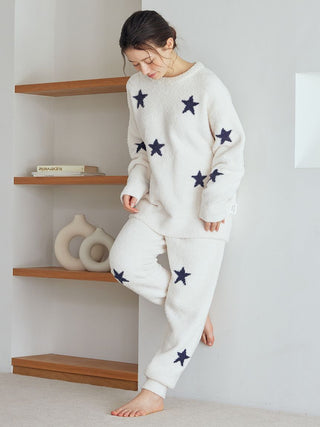 Woman wearing off-white Powder Star Jacquard Pullover by Gelato Pique USA, featuring cozy navy star patterns, premium loungewear.