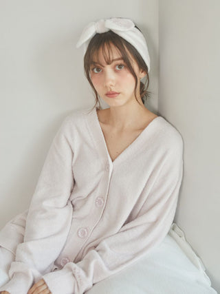 Woman wearing a plush Smoothie Button-Up Cardigan by Gelato Pique USA, showcasing cozy and timeless style while lounging.