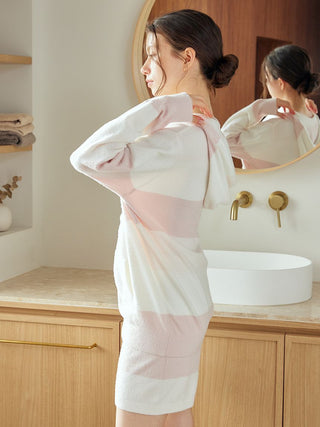 Woman wearing Gelato Pique USA Durable Smoothie Border Comfort Hoodie, showcasing premium loungewear style in a cozy bathroom setting.