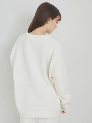 Back view of model wearing Cake Jacquard Pullover Sweater in soft knit fabric, featuring a cozy and relaxed fit.