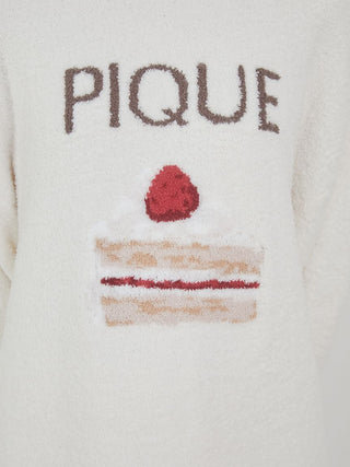 Close-up of Cake Jacquard Pullover Sweater with cake motif and PIQUE lettering, showcasing cozy, soft knit loungewear design.