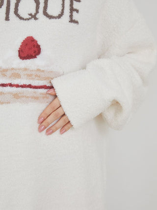 Close-up of a Cake Jacquard Pullover Sweater with cake motif and 'PIQUE' lettering, showcasing cozy knit texture.