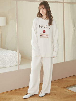 Woman wearing Cake Jacquard Pullover Sweater by Gelato Pique USA, featuring a cozy knit with cake motif and 'PIQUE' lettering.