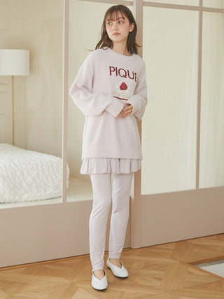 Woman wearing Cake Jacquard Pullover Sweater by Gelato Pique USA with cake motif and 'PIQUE' lettering, perfect cozy loungewear.