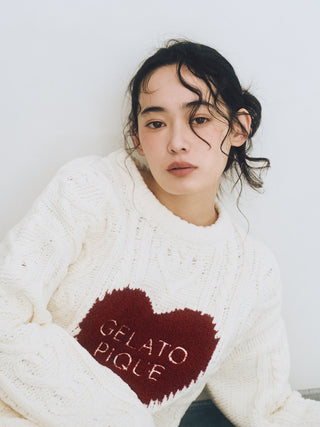 Woman wearing Heart Aran Pullover Sweater with embroidered heart motif by Gelato Pique USA.