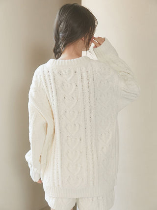 Alt Tag: Woman wearing Heart Aran Pullover Sweater with intricate cable-knit pattern and heart motifs, showcasing cozy and elegant knitwear.