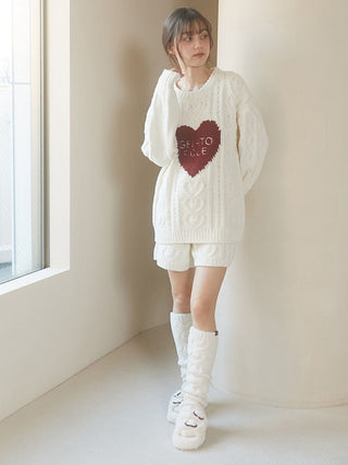 Cozy Heart Aran Pullover Sweater with cable-knit pattern and heart motif, worn by model, featuring Gelato Pique embroidery.