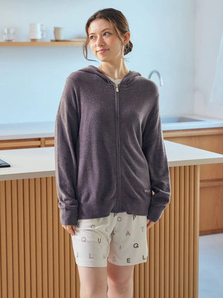 Woman wearing Smoothie Lite Hoodie Jacket, a premium loungewear piece by Gelato Pique USA, in a minimalist kitchen setting.