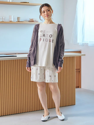 Woman wearing Smoothie Lite Hoodie Jacket, Gelato Pique USA loungewear, embodying premium sleepwear style in a modern kitchen.