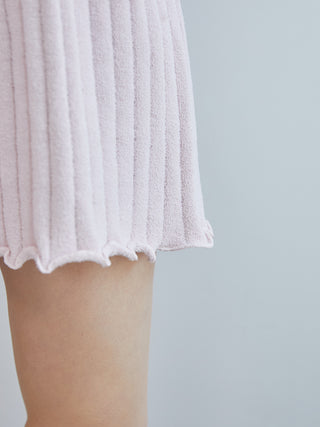 Close-up of 2025 ribbed shorts in pink with feminine ruffled hem design.