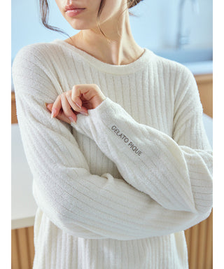 Alt Tag: Woman wearing a white Thermal Smoothie Pullover Sweater by Gelato Pique USA, showcasing premium loungewear and sleepwear elegance.