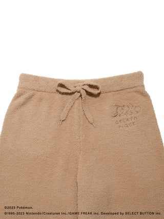 Men's Baby Moco Eevee shorts from Pokémon Sleep collection in soft brown fabric with embroidered logo detail.