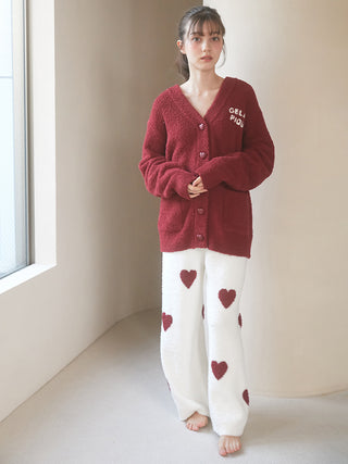 Woman wearing Chocolate & Framboise Baby Moco Heart Lounge Pants with heart design, perfect for cozy lounging.